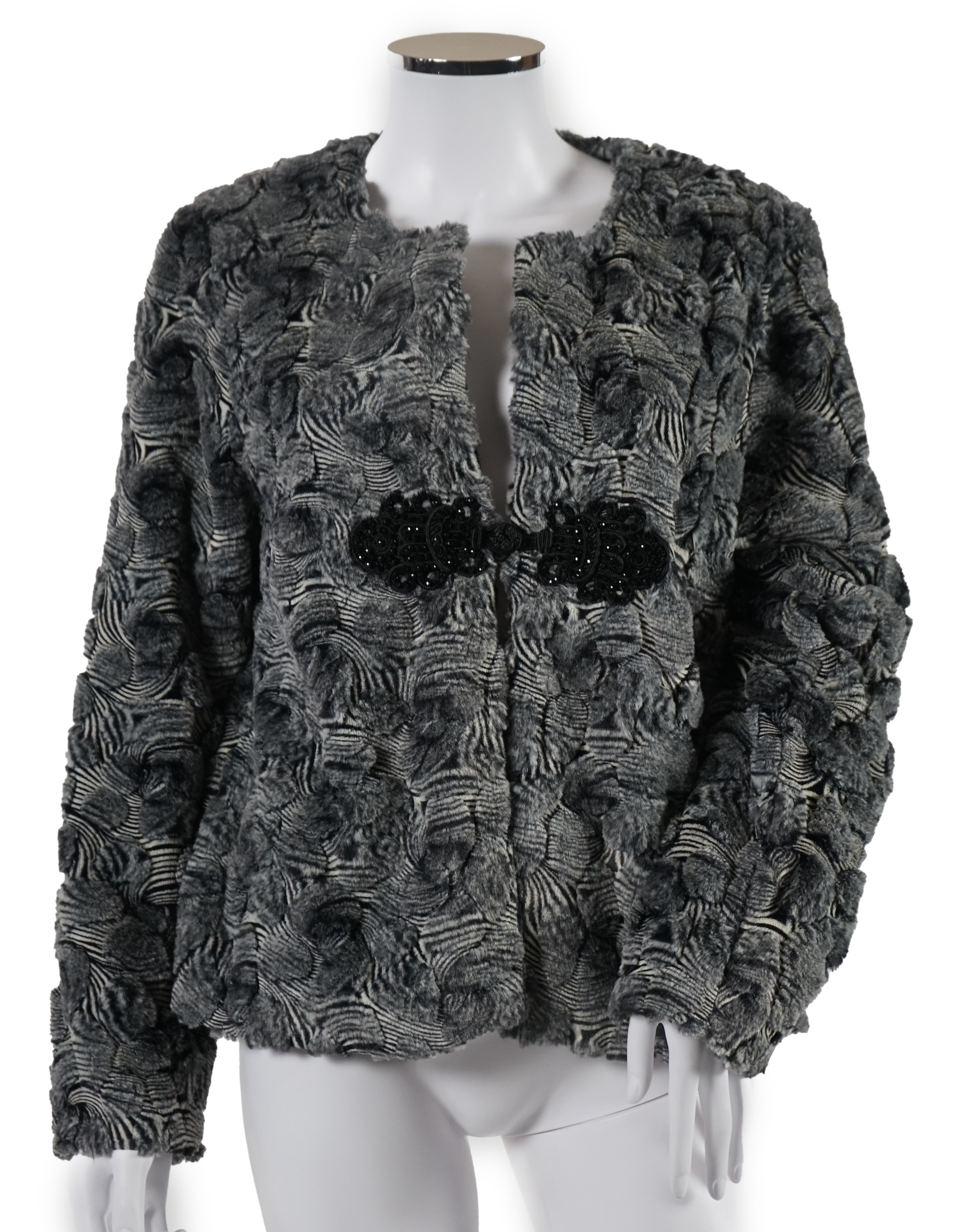 A selection of lady's evening tops and jackets, all black with sequin embellishments, six pieces in total. Proceeds to Happy Paws Puppy Rescue